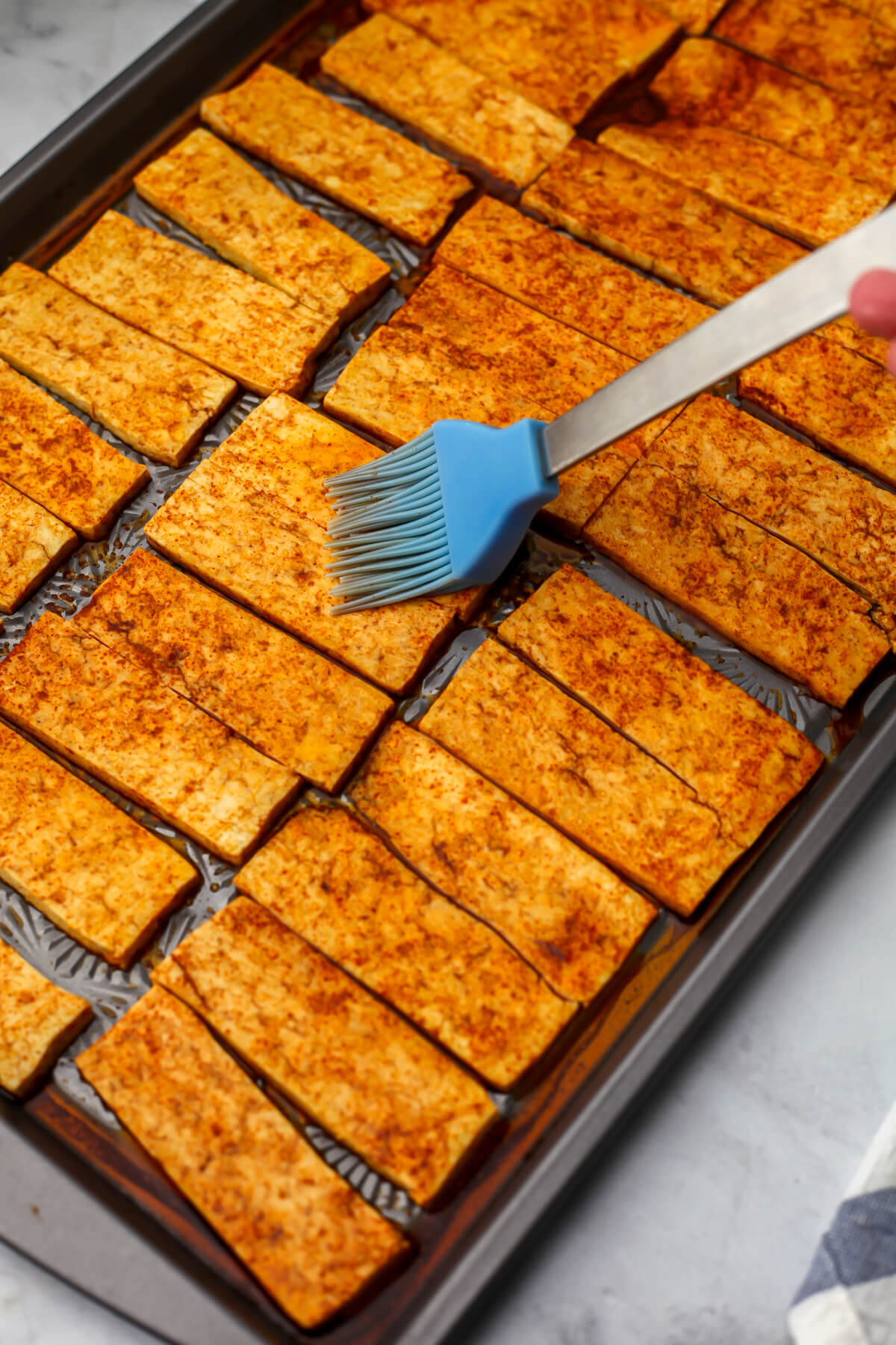 Tofu strips coated in a smoky marinade.