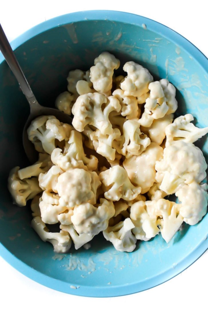 Cauliflower florets coated in batter.