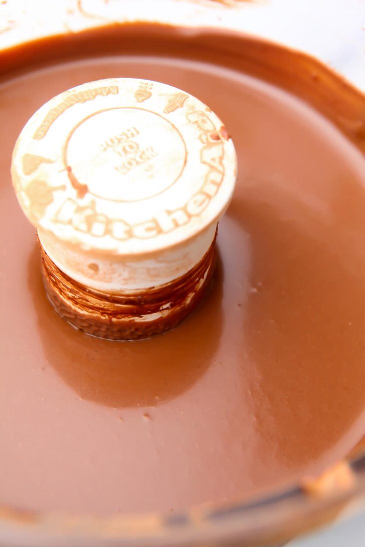 The filling for a vegan chocolate tofu pie blended in a food processor.