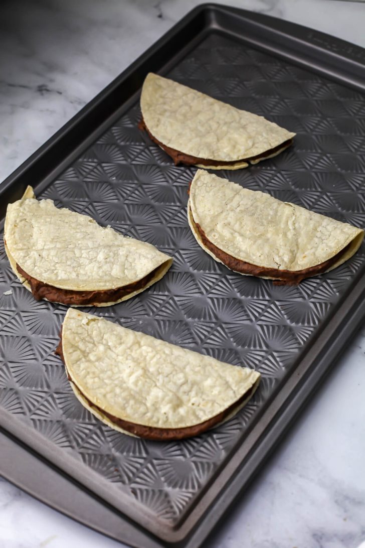 Vegan black bean taco folded over before frying.
