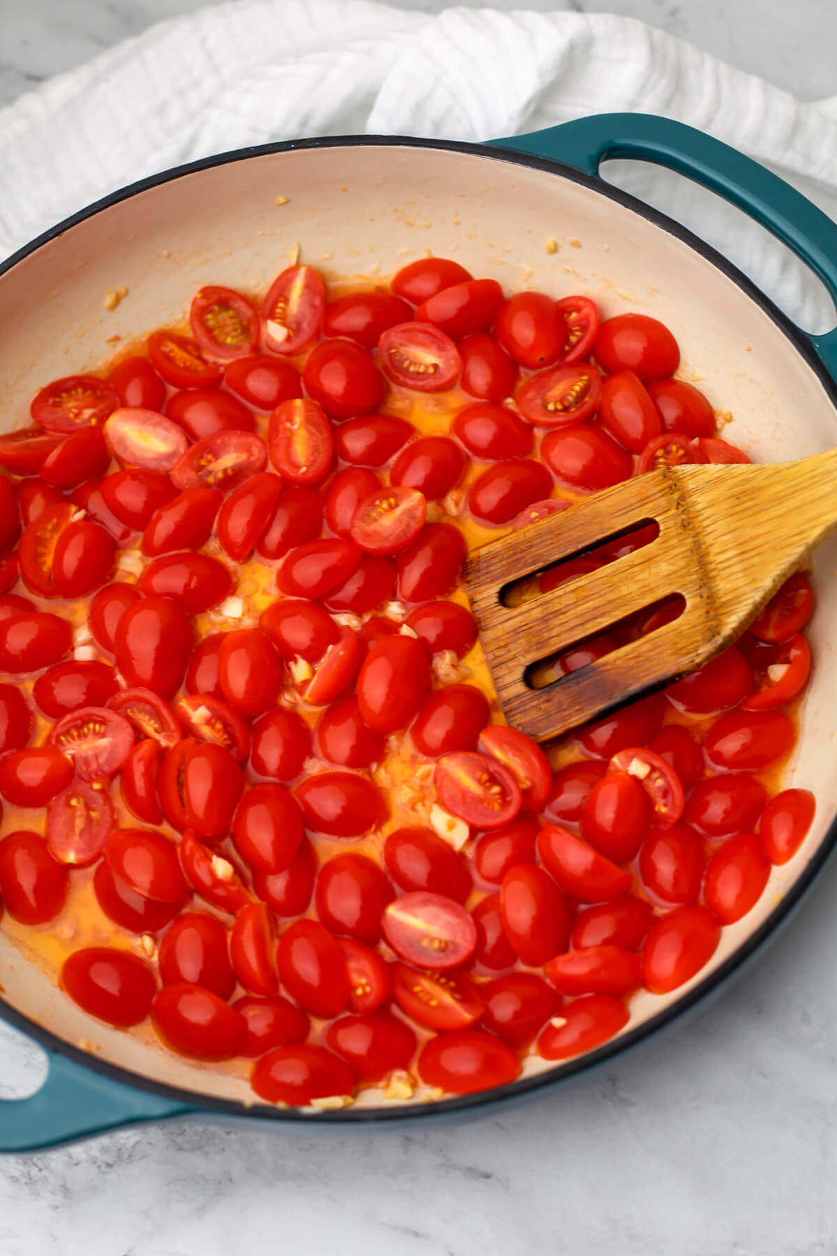 Cherry tomatoes cut in half and cooked in olive oil and garlic.