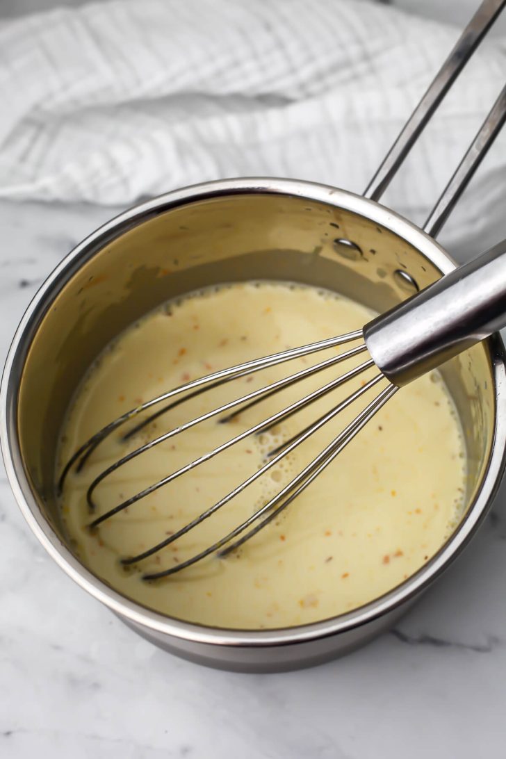 Oat milk cheese ingredients in a small pot before it has been cooked.