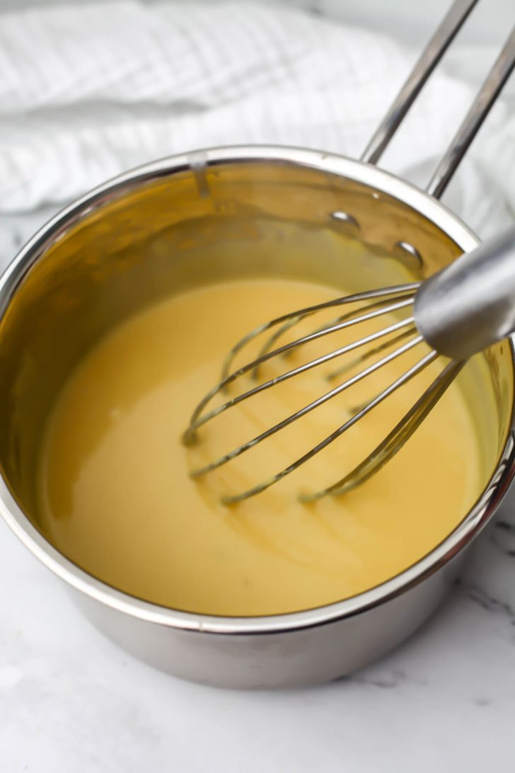 Oat milk cheese ingredients in a small pot after it has been cooked.